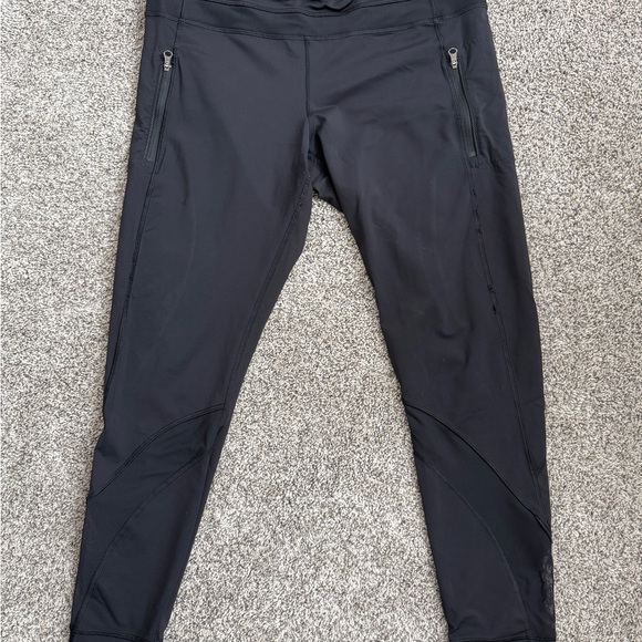 Lululemon black athletic pants with zippered pockets and a tapered silhouette - Picture 2 of 5